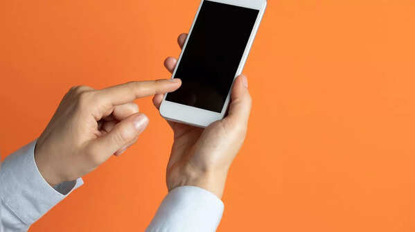 One hand holds phone, index finger scrolls