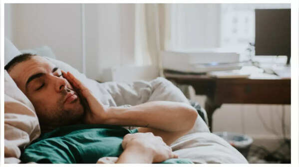 Tired person sitting on a couch