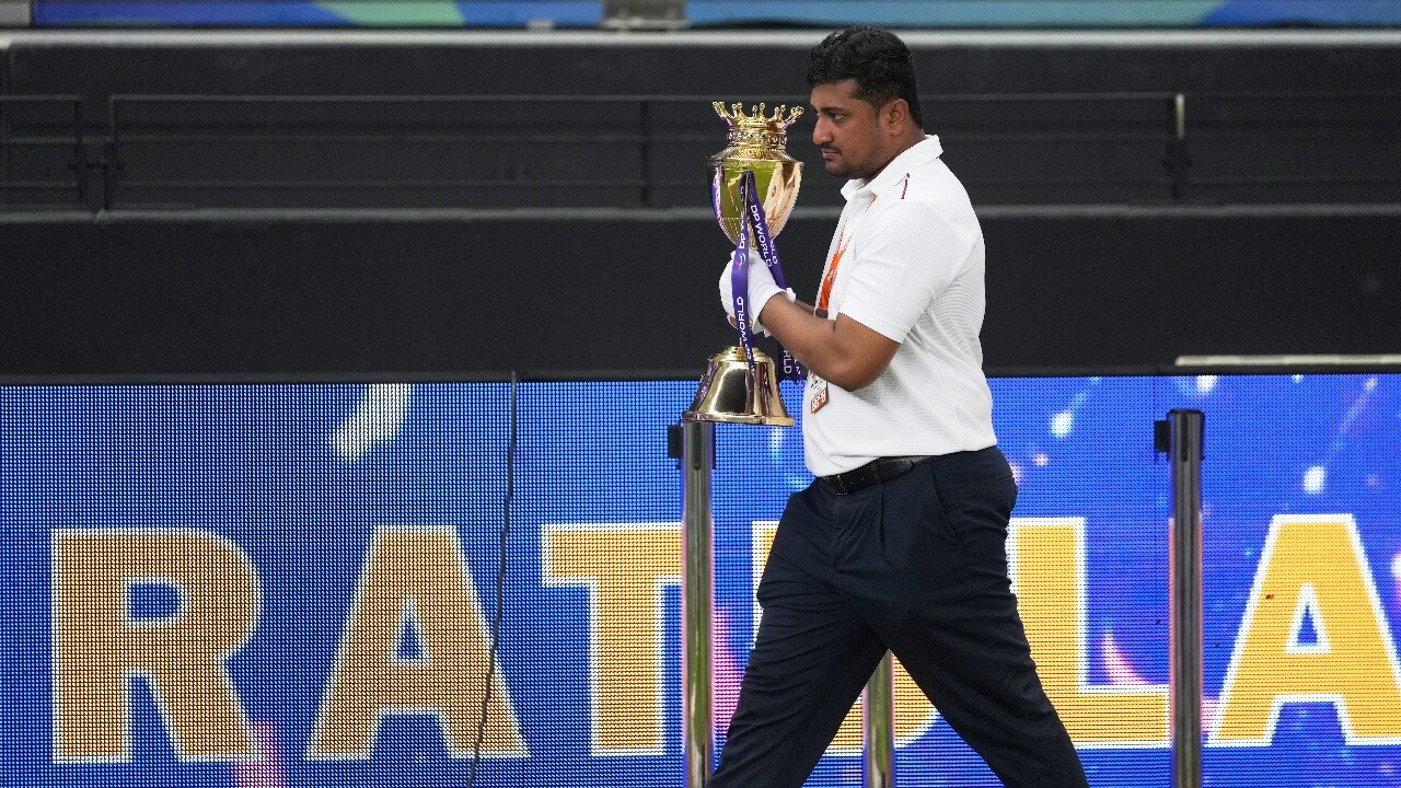 ACC officials walks away with the Asia Cup trophy. (AP Photo) Asia Cup trophy